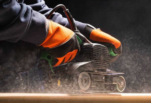 Carpenter works with belt sander in carpentry - Dai Nhan Machinery